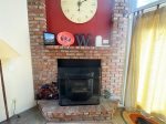 Mammoth Lakes Condo Rental Woodlands 28 - Living Room Pellet Stove & Deck on Sierra Star Golf Course